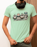 A man wearing a green t-shirt with a graphic design of cartoon-style penguins.